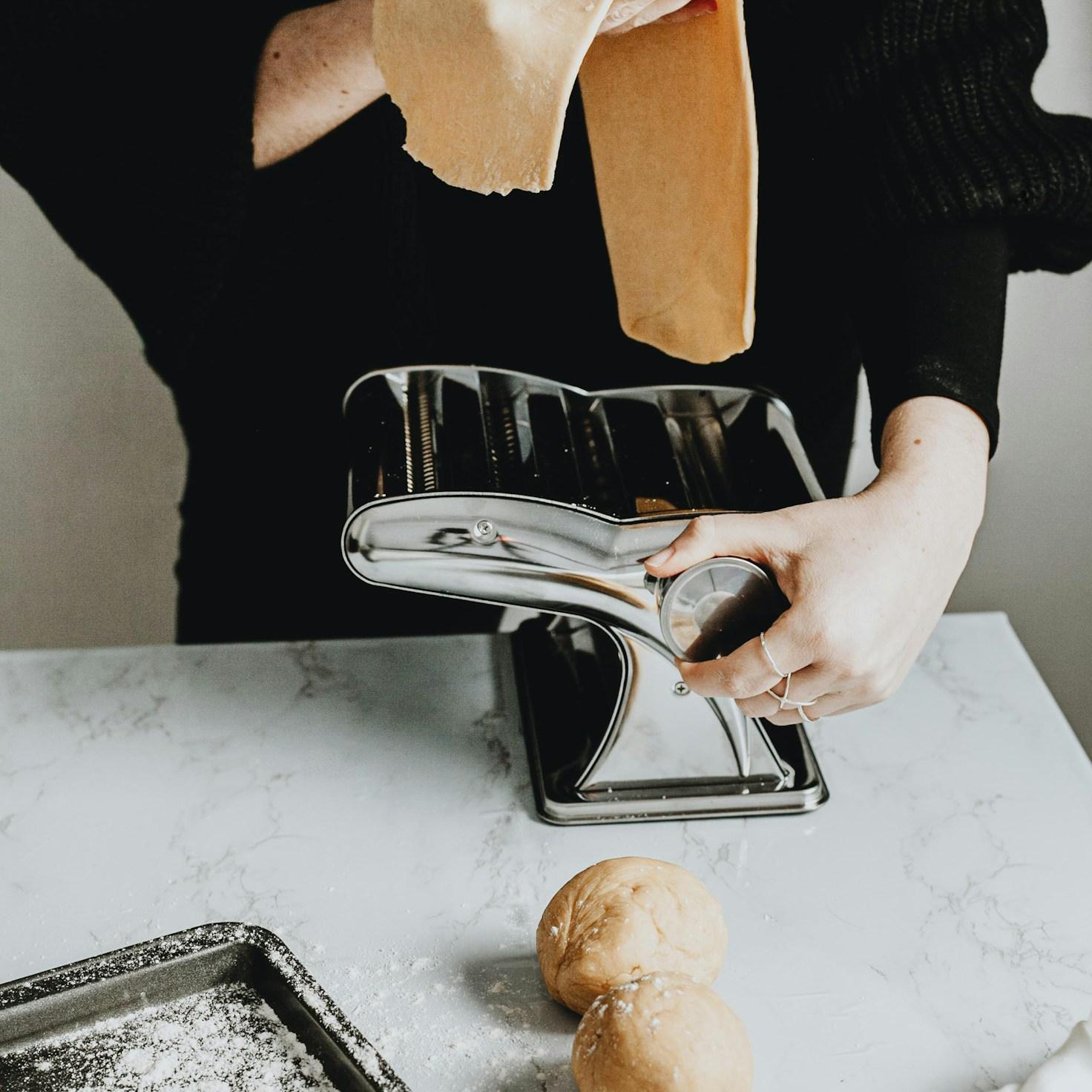 Community members collaborating in a modern kitchen space, sharing recipes and cooking techniques
